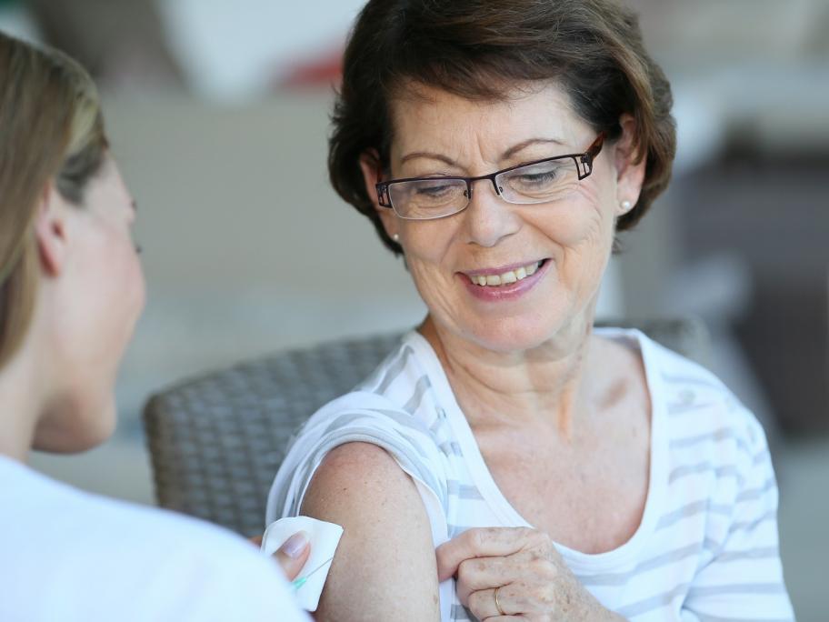 Senior woman having vaccination