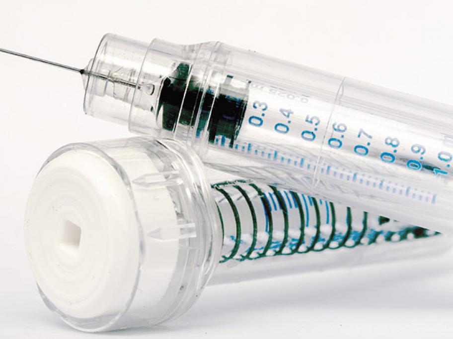 vial of heparin and syringe