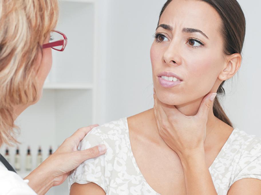 woman sore throat neck