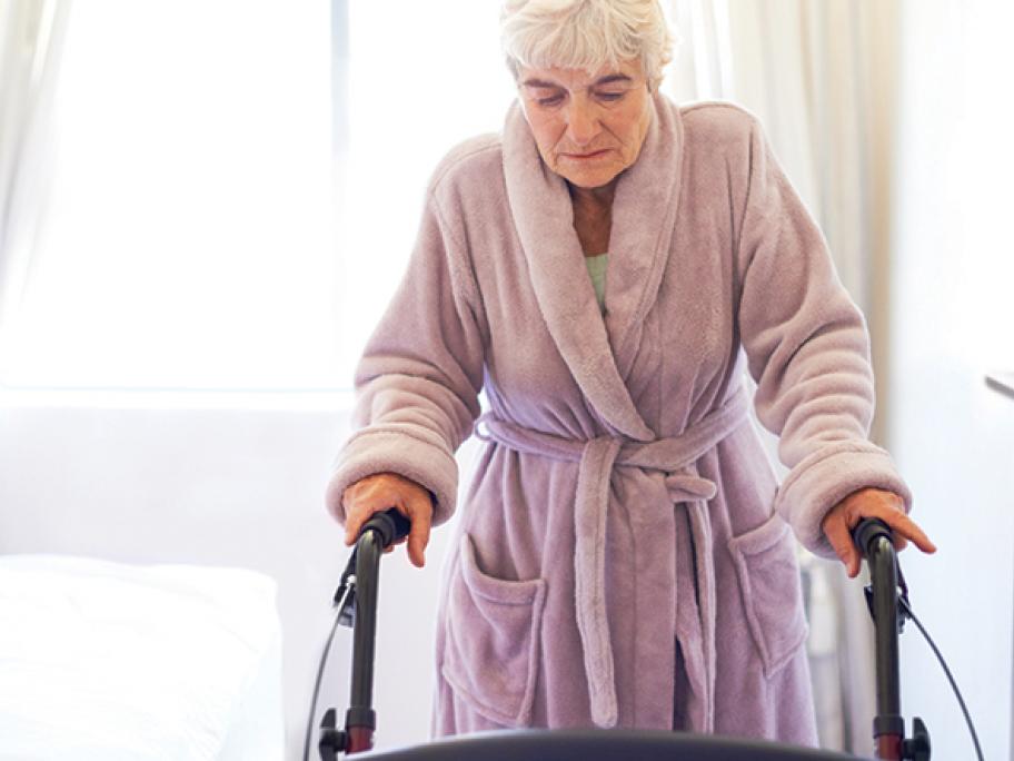 senior woman mobility walker walking frame