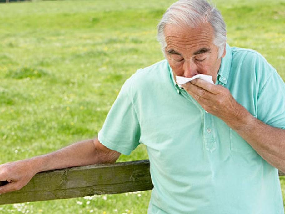 Older man coughing