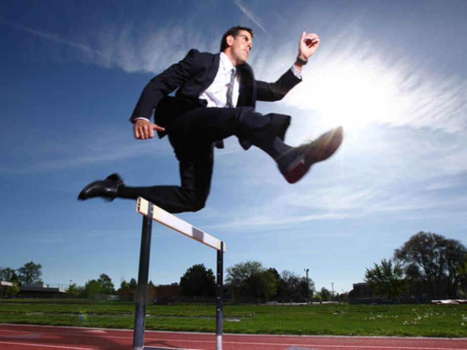 man jumping hurdle