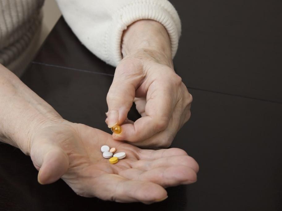 older woman with medicine