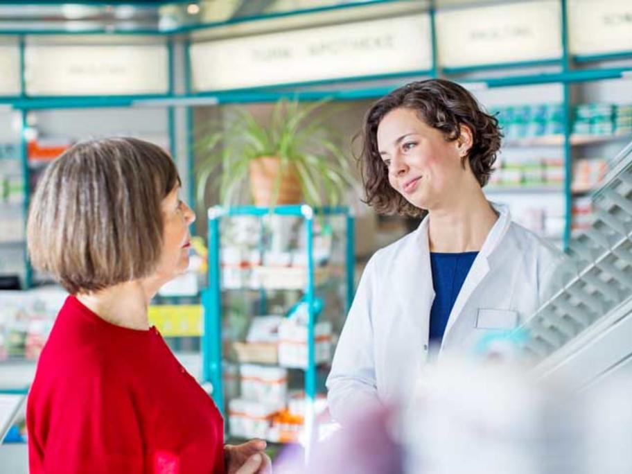 pharmacist helping patients