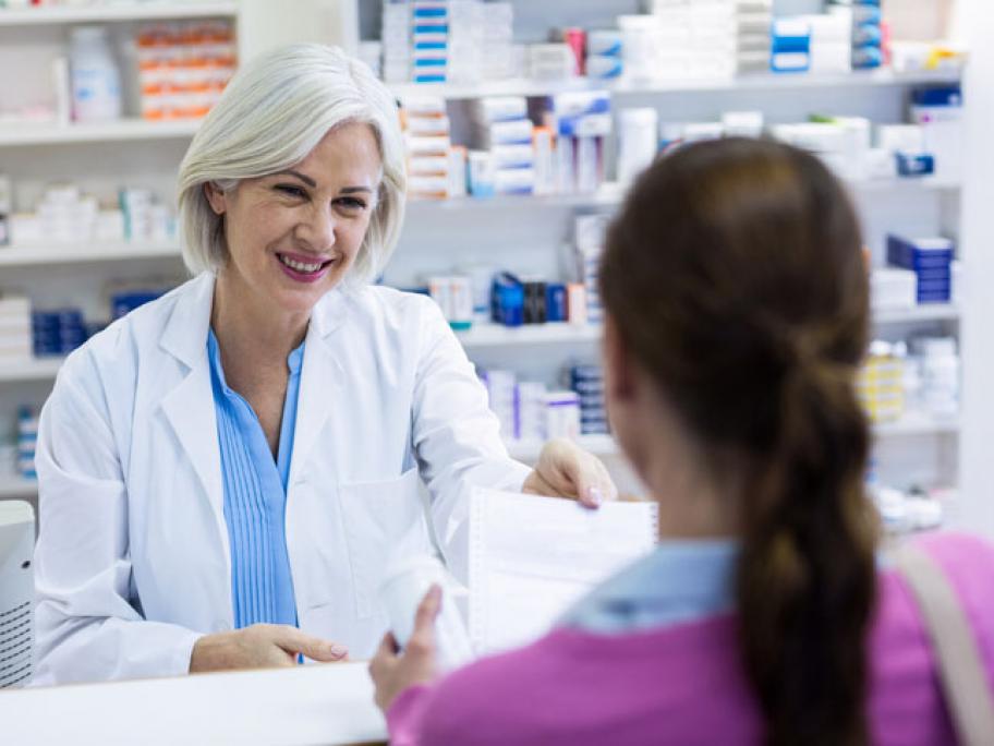 woman consults pharmacist