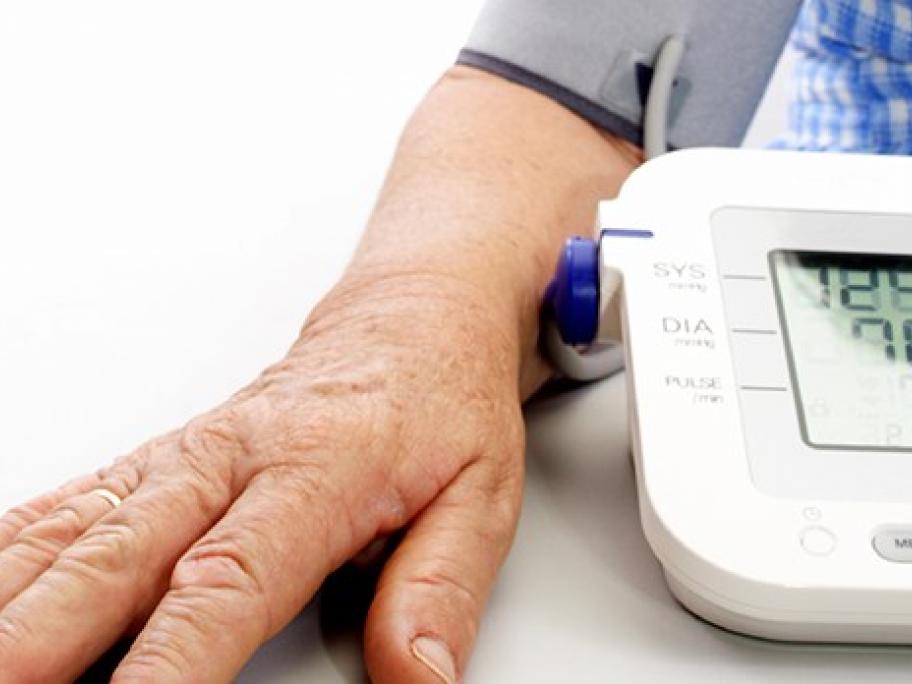 Old man having blood pressure measured