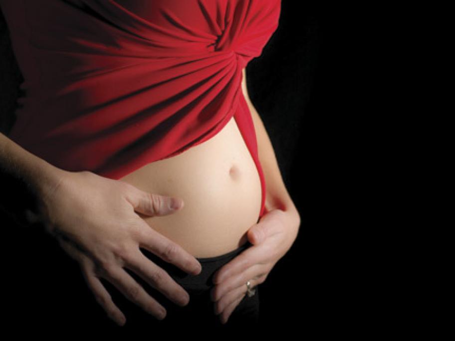 Woman's abdomen in early pregnancy