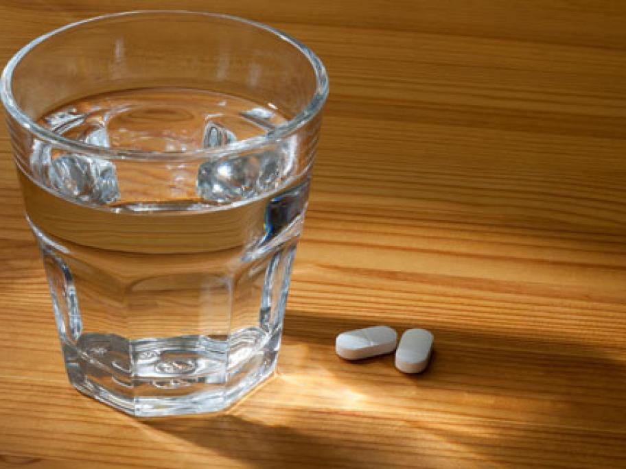 glass of water and tablets